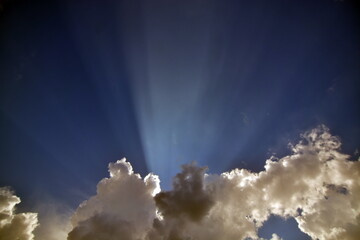 Sky and clouds with sun rays.