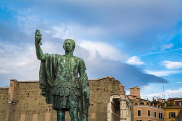 Fototapeta premium Statue of Imp Caesari Nervae with Forum of Augustus in background, Rome, Italy