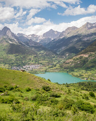 Fototapeta na wymiar View of Sallent de Gállego and the turquoise Lanuza Reservoir on the Gállego River in the Tena Valley of the Spanish Pyrenees, Huesca, Aragon