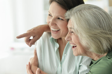 Portrait of  Senior woman with daughter at home