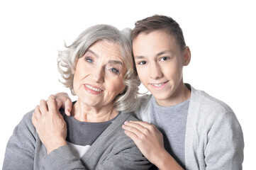 Portrait of smiling grandmother and grandson isolated on white background