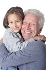 Portrait of happy grandfather and granddaughter isolated on white background