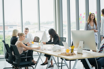 group of business people meeting and discussing a project at meeting room 
