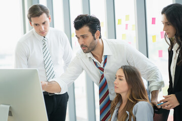 group of business people meeting and discussing a project at meeting room with computer.