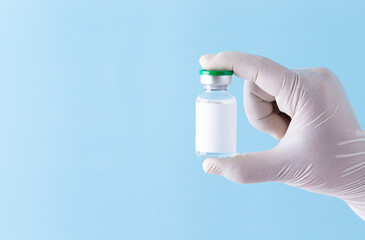 Close up Medicine bottle for injection, Medical glass vial for vaccination. Science equipment, liquid drug or vaccine from treatment, flu in laboratory, hospital or pharmacy, copy space background.