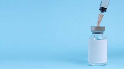 Syringe and vaccine flu, coronavirus covid-19, influenza  Science equipment, liquid drug or vaccine...