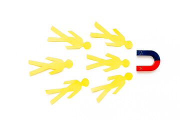 Increase team concept with horseshoe magnet and human figures