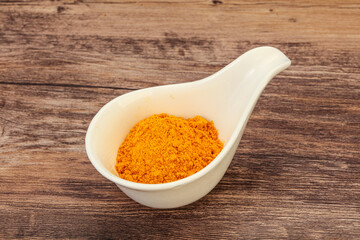 Tumeric powder in the bowl