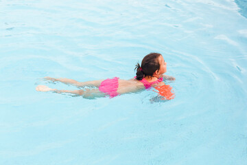 happy girl in the swimming in swimming suit