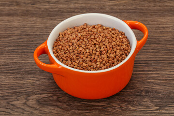 Raw buсkwheat cereal in the bowl