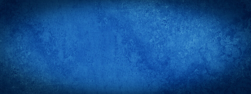 Dark blue abstract stone concrete paper texture background banner panorama with vignette.