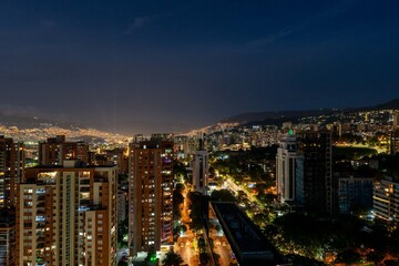 Fototapeta na wymiar Medellin, Antioquia, Colombia. December 21, 2020: Night urban landscape with buildings in El Poblado.