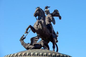 Fototapeta premium Saint George strikes the Serpent with a spear. St. George the Victorious is a symbol of the city of Moscow. On the spherical dome of the Okhotny Ryad Shopping Center n the Manezhnaya Square
