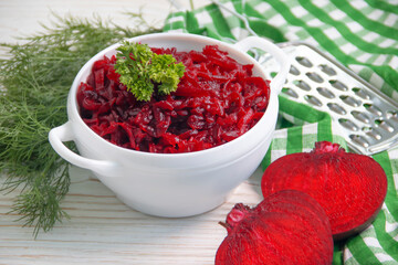 boiled grated beetroot on a wooden background