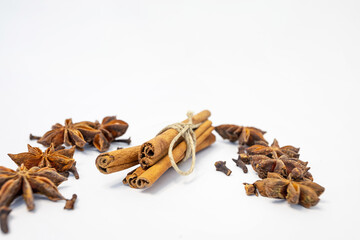 background with the image of cinnamon and anise isolated on a white background. spices. place for text on a white background