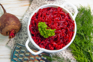 boiled grated beetroot on a wooden background