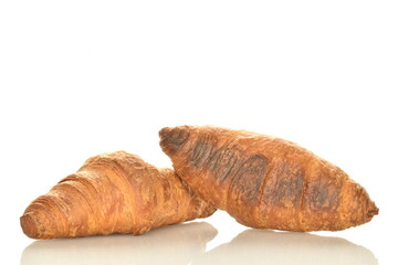 Two fragrant croissants with chocolate filling, close-up, isolated on white.