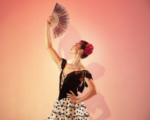 Flamenco dancer Spain woman gypsy with red rose and spanish hand fan - obrazy, fototapety, plakaty
