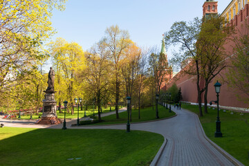 Walking path under the walls of the Moscow Kremlin in the Alexander Garden on a spring day. The architecture of the capital of Russia.