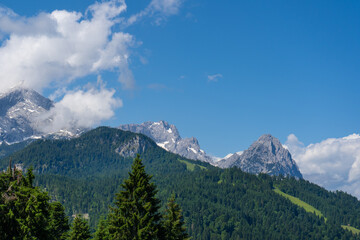 Fototapeta na wymiar View from the Eckbauer mountain over the Bavarian Alps near Garmisch-Partenkirchen