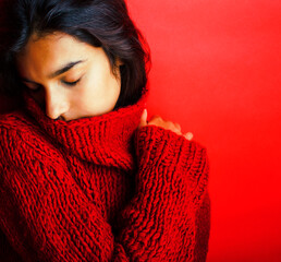 young pretty indian girl in red sweater posing emotional, fashion hipster teenage, lifestyle people concept