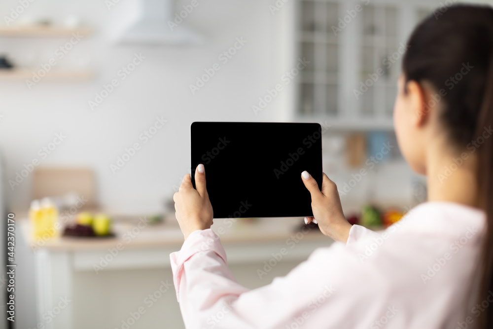Aufkleber Lady using digital tablet with blank empty screen, mock up