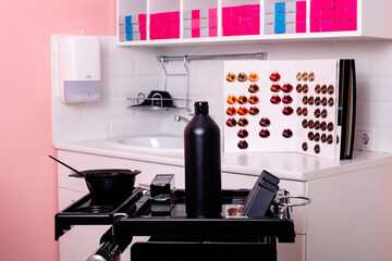 Color bar with sink and working tools in hairdressing salon