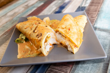recipe for savory crepes stuffed with seafood. seafood crepes
