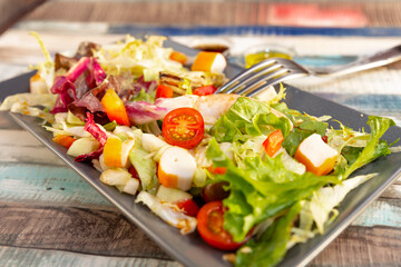multicolor seafood salad with proteins and vegetables