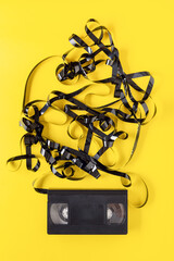 classic VHS videotape on a yellow background.