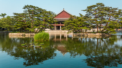 Fototapeta na wymiar Gyeonghoeru Pavilion near peaceful pond, Gyeongbokgung Palace, Seoul, South Korea. Traditional korean architecture.