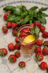 Refreshing drink. Lemonade with strawberries and lemon. Summer cocktail. Strawberry lemonade with basil. Country rest