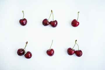 ripe red cherries on a white background