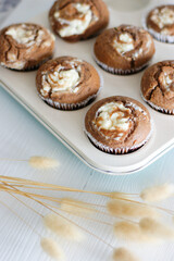 Chocolate cupcakes with a curd cheese cap. Mini cakes with cottage cheese and coconut cream.