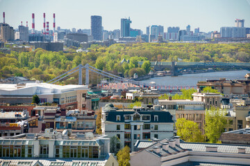 Fototapeta premium Top view of the rooftops of residential buildings in the Khamovniki district, Moscow and Moscow River from height