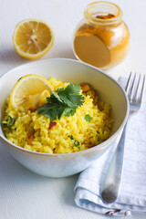 Lemon rice with spices  and nuts. Indian cuisine