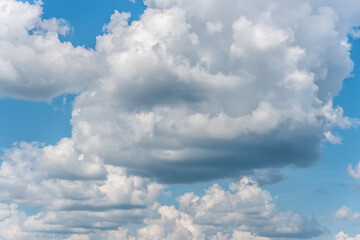 Fototapeta na wymiar White Clouds in a Blue Sky on a Summer Day