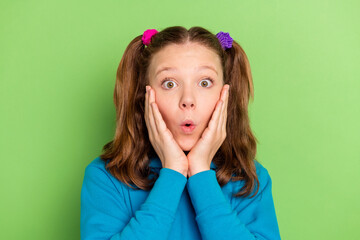 Photo of amazed excited shocked small girl hold hands cheekbones news isolated on pink color background