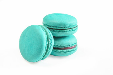 Blue macaroons isolated on white background. Closeup of delicious 
french dessert