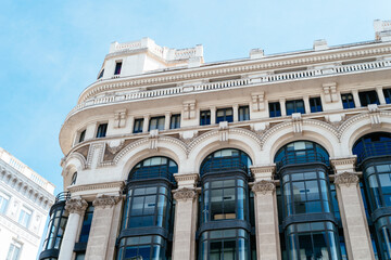 Obraz premium Historic buildings in Gran Via, the iconic avenue of Madrid famous for his cinemas and stores