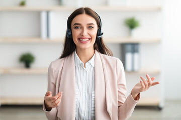 Portrait Of Hotline Operator Lady Wearing Headset Talking In Office