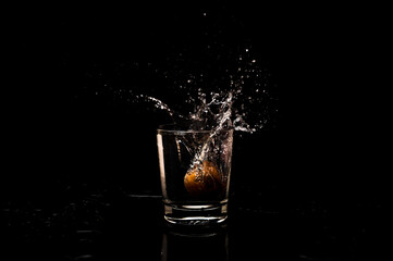 High resolution water splash freeze motion from a clean glass of water with droplet and bubble formation