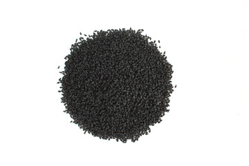 Pile of black cumin seeds isolated on white background. Nigella sativa