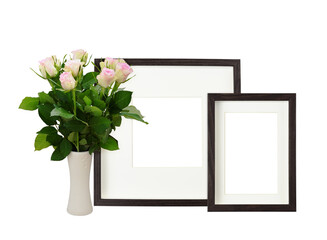 Dark brown wooden frames with bouquet of rose flowers isolated on white background