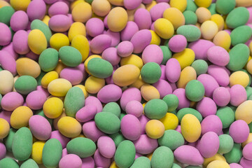 Group of colorful peanuts in glaze.