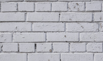 White brick wall with scratches 