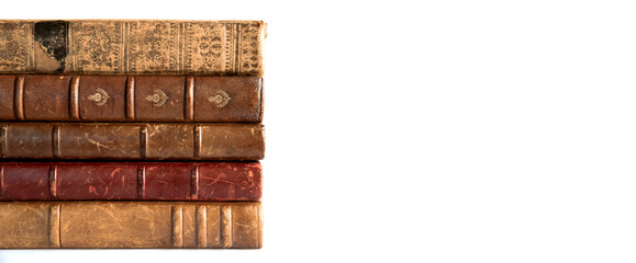 Stack of old books on white background banner