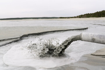 discharge of fine sand into the tailing dump