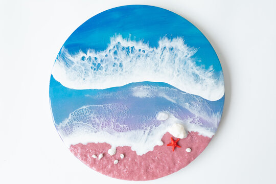 Resin art with sea waves and beach with starfish. Epoxy paint art