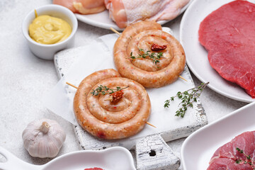Raw uncooked chicken sausages with spices
